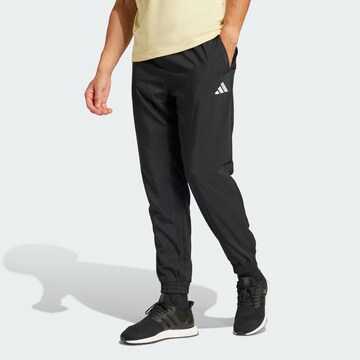 ADIDAS SPORTSWEAR Tapered Sports trousers 'Essentials' in Black: front