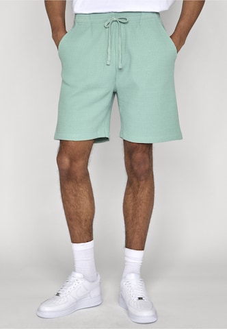 Urban Classics Regular Trousers in Green: front