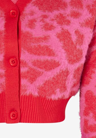 Cardigan swirly en rose