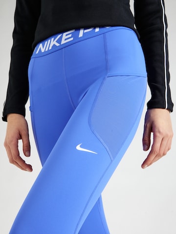 NIKE Skinny Sportbroek in Blauw