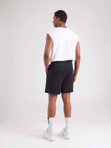 Nike Sportswear Ohlapna forma Hlače 'TECH FLC' | črna barva