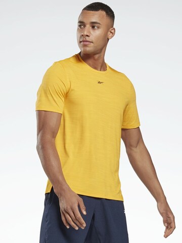 Reebok Performance Shirt in Gold: front