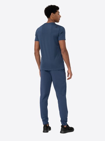 Effilé Pantalon de sport 4F en bleu