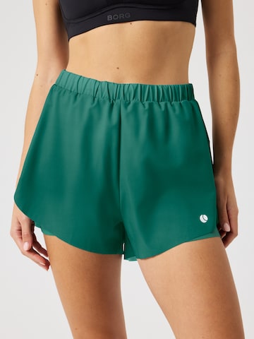 BJÖRN BORG Regular Workout Pants 'ACE 2 IN 1' in Green: front