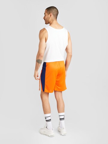 Regular Pantaloni sport de la NIKE pe portocaliu