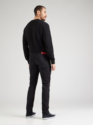HUGO Slimfit Jeansy 'HUGO 734' w kolorze czarny
