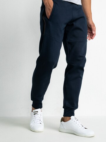 Petrol Industries Tapered Trousers in Blue: front