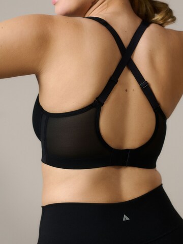 Invisible Soutien-gorge de sport Next en noir