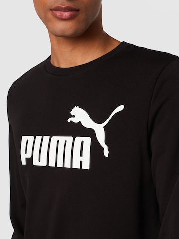 PUMA Športna majica 'Ess' | črna barva