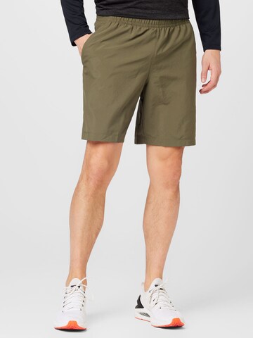 Regular Pantalon de sport UNDER ARMOUR en vert : devant