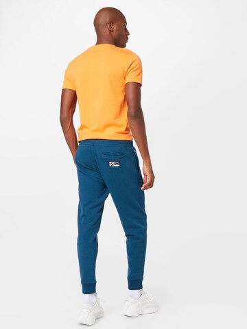 Superdry Tapered Nadrág - kék