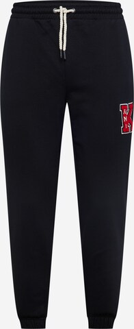 Karl Kani Tapered Trousers in Black: front