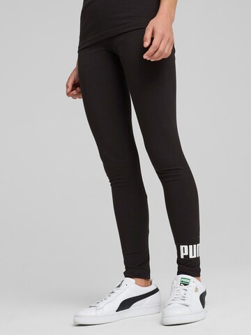 Skinny Leggings 'Ess No. 1' di PUMA in nero: frontale