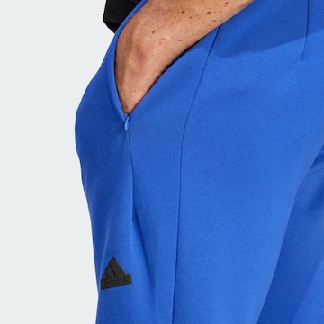 ADIDAS SPORTSWEAR Zúžený strih Športové nohavice 'Z.N.E. Premium' - Modrá