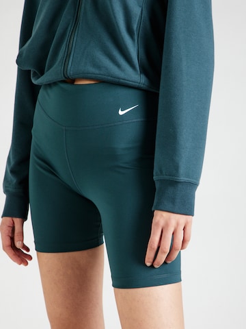 NIKE Skinny Spodnie sportowe 'One' w kolorze zielony