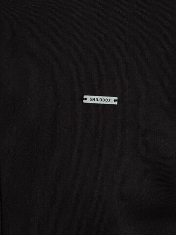 Veste de survêtement Smilodox en noir