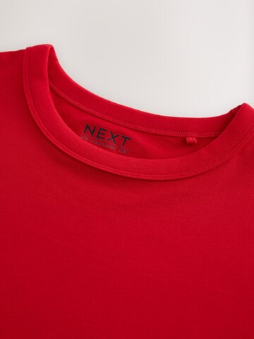 Tricou de la Next pe roșu