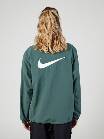 Nike Sportswear Between-season jacket 'Essential' in Green: front