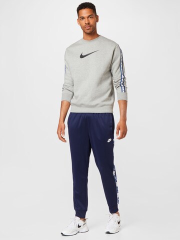 Nike Sportswear Zúžený strih Nohavice - Modrá