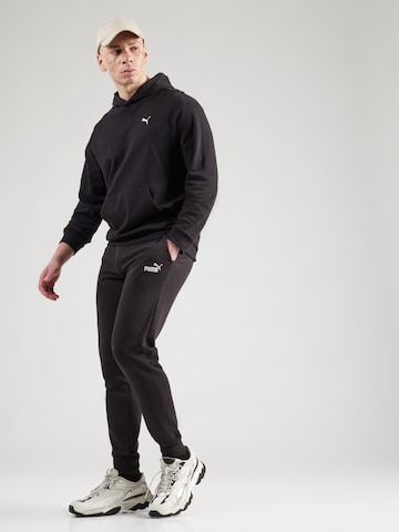 PUMA Конический (Tapered) Спортивные штаны 'Ess No. 1' в Черный