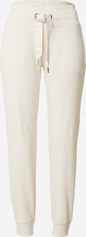 Tapered Pantaloni sportivi di DKNY Performance in beige: frontale