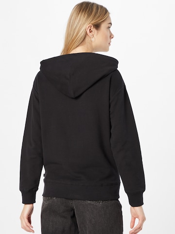 LEVI'S ® Tréning póló 'Graphic Standard Hoodie' - fekete