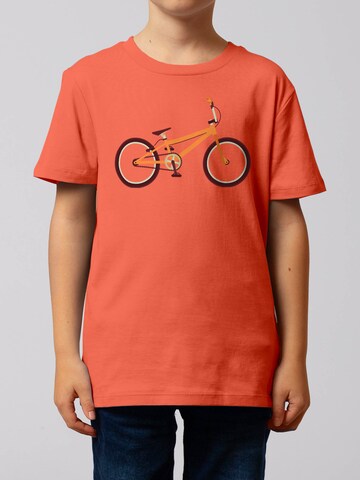 watabout.kids T-Shirt 'Bmx' in Orange: Vorderseite