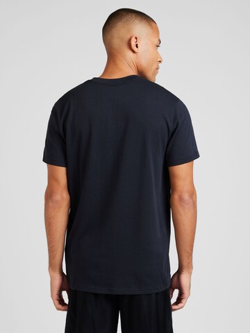 Maglia funzionale di UNDER ARMOUR in nero