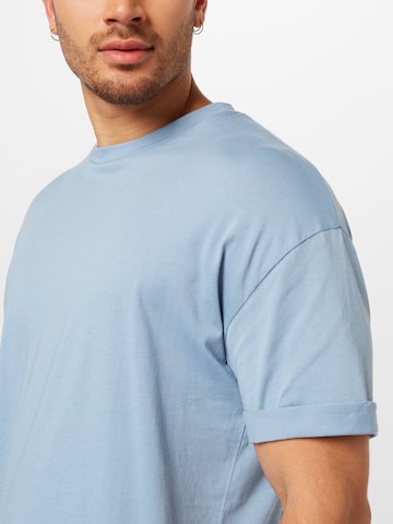 mėlyna DRYKORN Standartinis modelis Marškinėliai 'Thilo'