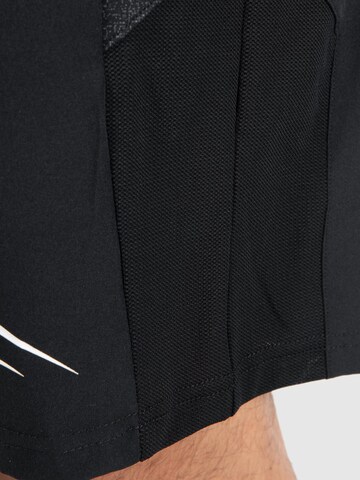 Regular Pantalon de sport Smilodox en noir