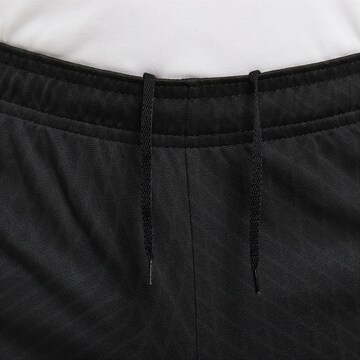 NIKE Loose fit Sports trousers 'Strike' in Black