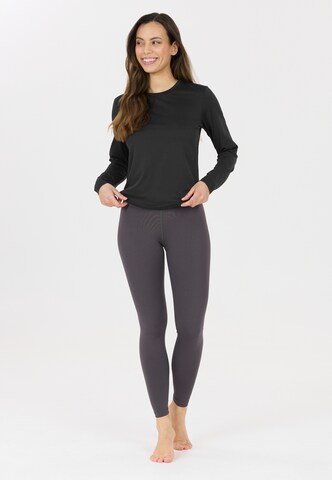 Athlecia Langarmshirt Doja in Schwarz