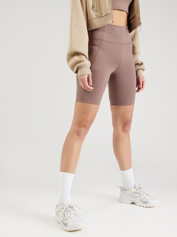 Skinny Pantalon de sport Girlfriend Collective en marron : devant