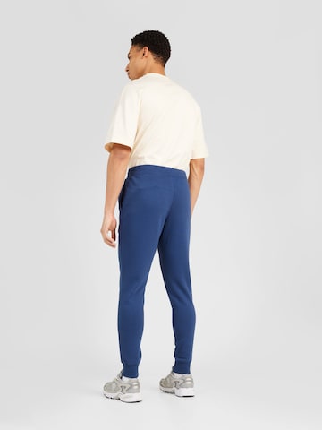 Tapered Pantaloni 'Classic Core' di new balance in blu