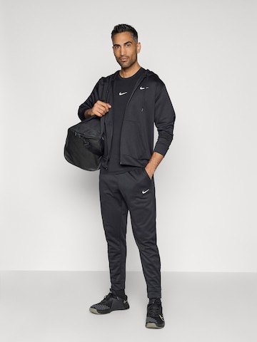 NIKE Urheilullinen collegetakki 'FLEX' värissä musta