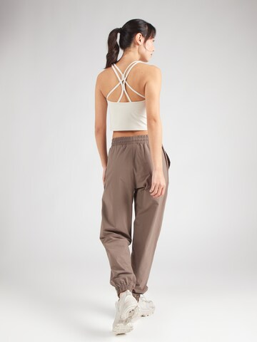Athlecia Tapered Sports trousers 'Hero' in Brown