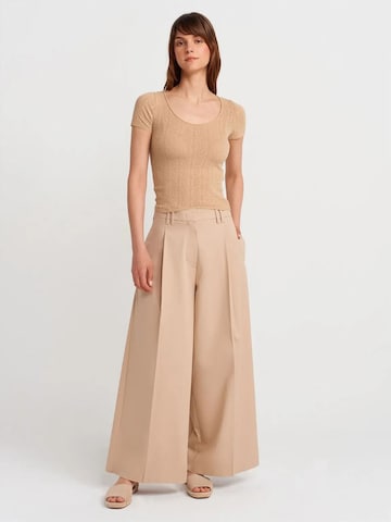 Pullover di Dilvin in beige
