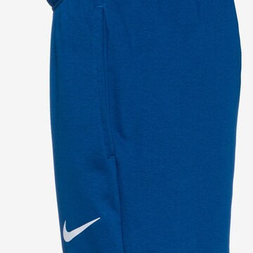NIKE Tapered Athletic Pants in Blue