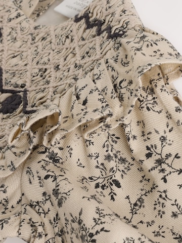 Barboteuse / body Next en beige