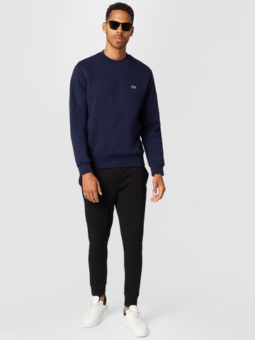 LACOSTE Sweatshirt i blå