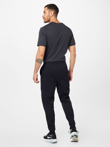 Nike SportswearTapered Hlače - crna boja