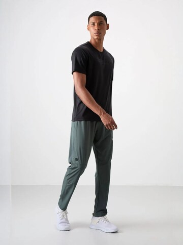 Pantalon de sport 'Jogginghose' Tommy Life en vert