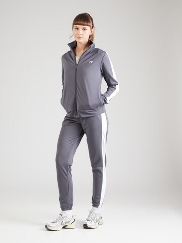 UNDER ARMOUR Skinny Tréningruha - szürke: elől