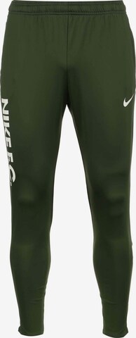 NIKE Slim fit Workout Pants in Green: front