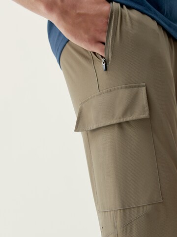Born Living Yoga Tapered Weatherproof pants 'Minho' in Brown