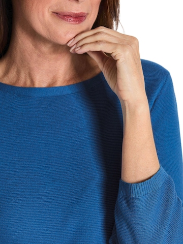 Goldner Pullover in Blau