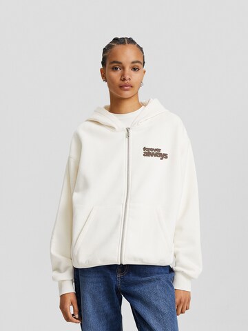 Bershka Zip-Up Hoodie in Beige: front