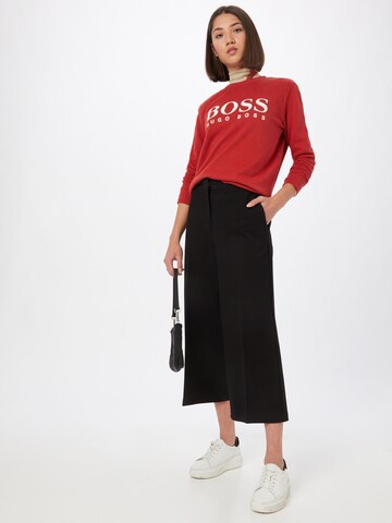 Wide leg Pantaloni con piega frontale 'Teslima' di BOSS in nero