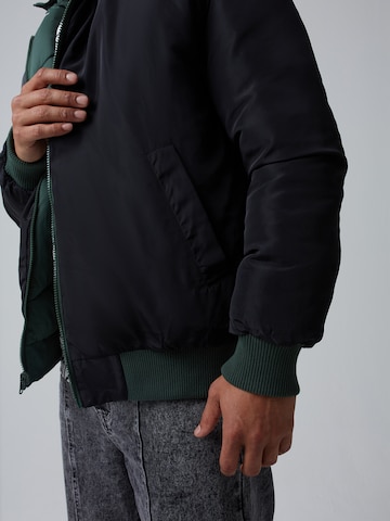 ABOUT YOU x Benny Cristo Between-Season Jacket 'Bruno' in Green