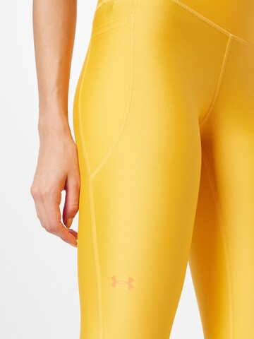 Skinny Pantaloni sportivi di UNDER ARMOUR in giallo